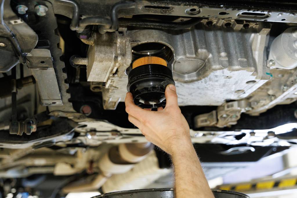 New engine oil filter being installed
